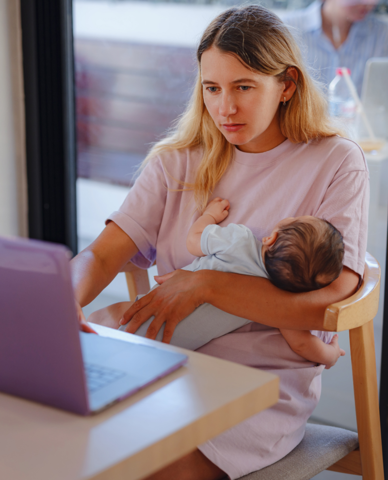 Mom Baby Maternity Leave at Desk With Computer Baby Sleeping