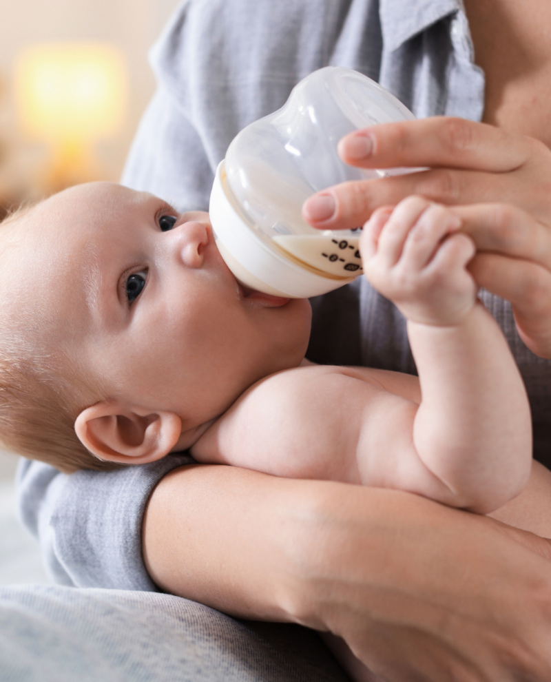 Baby Mom Feeding Baby with Bottle